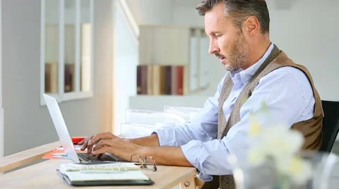 Man working on laptop computer Stock Footage 56057414