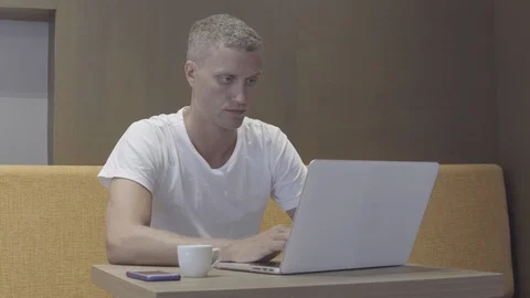 Man working at laptop computer Stock Footage 88702809