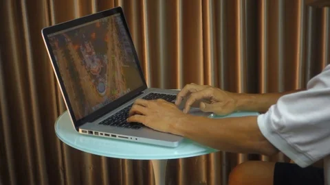 Man working on laptop computer Stock Footage 99296432