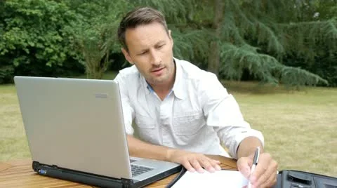 Man working with laptop computer at home Video stock 14831847
