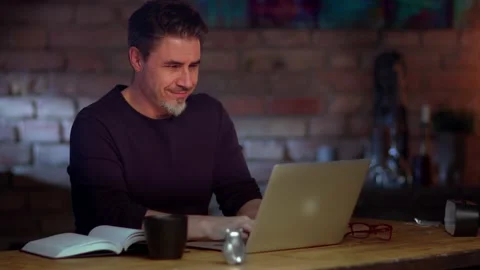 Man working with laptop computer at home office Stock Footage 132919279