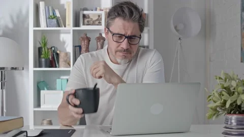 Man working with laptop computer at home at morning Stock Footage 148023212