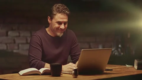 Man working with laptop computer at home office Stock Footage 148431680