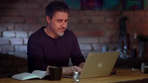 Man working with laptop computer at home office Stock Footage 148431769