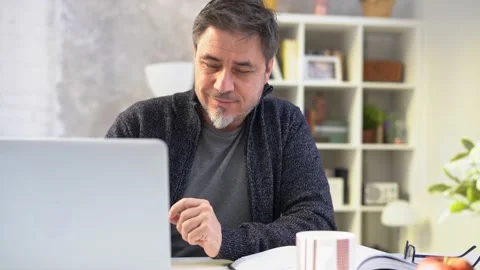 Man working with laptop computer at home at morning Stock Footage 149201688