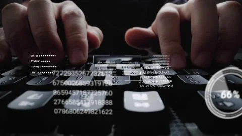 Man working on laptop computer keyboard with graphic user interface GUI hologram Stock Photos