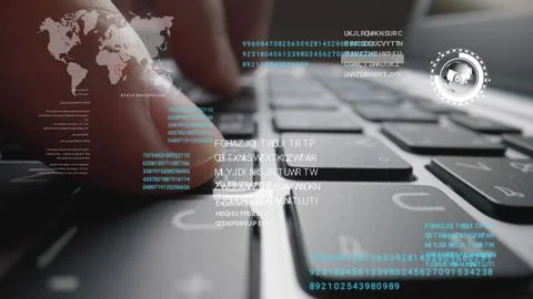 Man working on laptop computer keyboard with graphic user interface GUI hologram Stock Photos