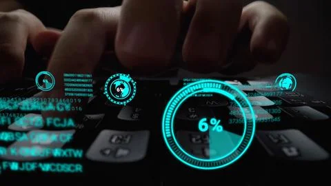 Man working on laptop computer keyboard with graphic user interface GUI hologram Stock Photos
