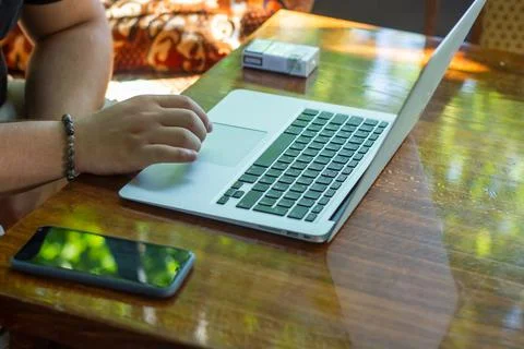 Man working on laptop computer, young man using laptop Stock Photos