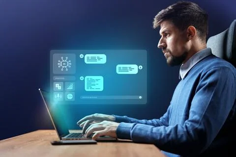 Man working on a laptop with data interface and graphs in a modern office 스톡 사진