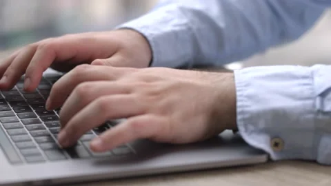 Man working with laptop on Desktop Next to Window. Stock Footage 194119798