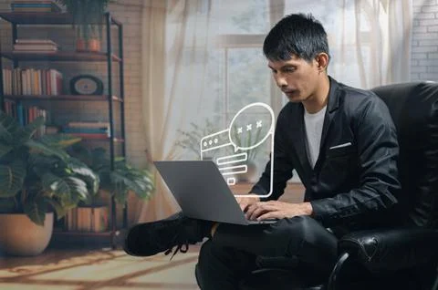 Man Working on Laptop with Digital Brain and Innovation Icons in Modern Liv.. Stock Photos