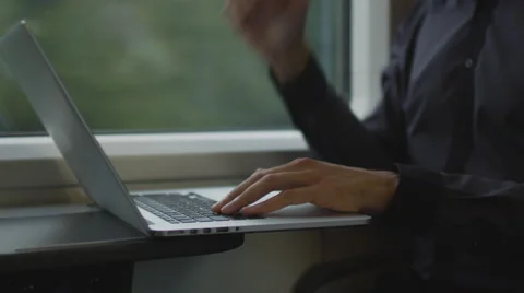 Man Working on Laptop in During Traveling on Train Stock Footage