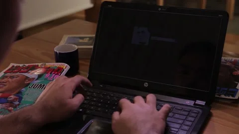 Man working on a laptop Stock Footage 244202099