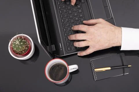 Man working with a laptop. Freelancer connecting to internet via computer. .. 写真素材