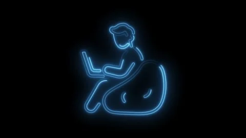 Man working on laptop glowing neon style on bean bag chair design element Stock Footage 330773572