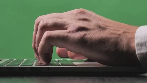 Man working with laptop on green screen Stock Footage 82687472