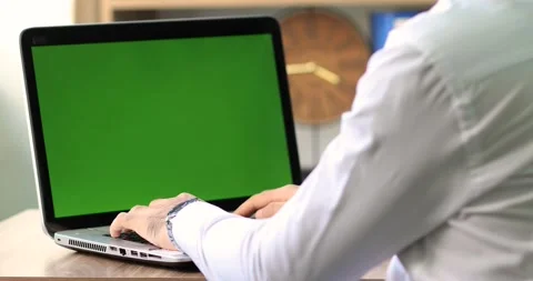 Man working on laptop with green screen Stock Footage 133918101