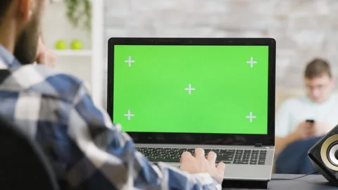 Man working on laptop with green screen 스톡 동영상 279653484