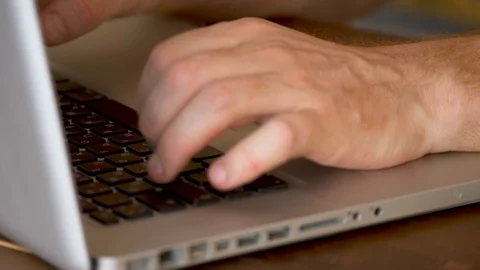 The man working on laptop, hands printing on the keyboard close-up Stock Footage 124647906