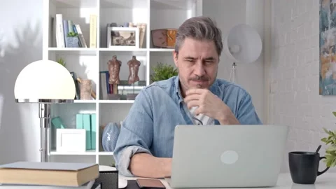 Man working with laptop at home office video call Stock Footage 148024093