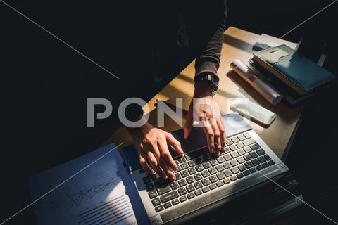 Man working on a laptop in home Stock Photos
