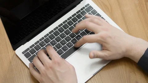 Man working on laptop at the kitchen Stock Footage 106348715