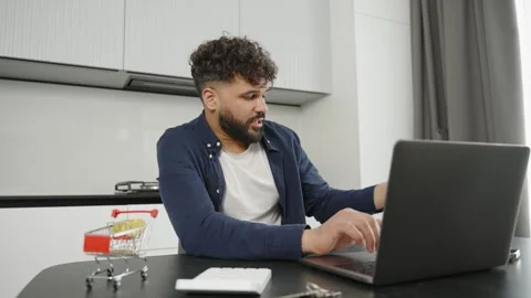 Man Working on Laptop in Modern Kitchen Stock-Footage 333982080