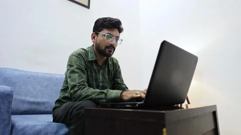 Man working on laptop in modern office lounge 01 Stock Footage 338425172