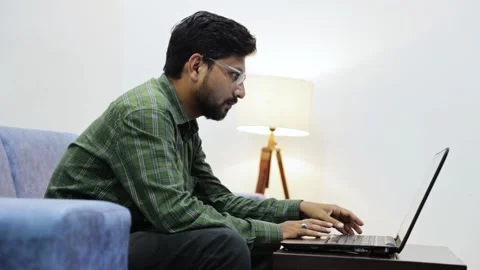 Man working on laptop in modern office lounge 03 Stock Footage 338425174