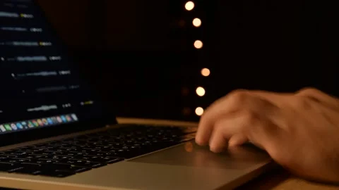 Man working on laptop at night Stock Footage 144145429