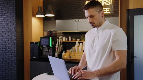 A man is working at a laptop in the office Stock Footage 219462271