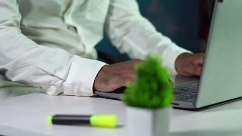Man working on laptop in office. Stockbeeldmateriaal 320137800