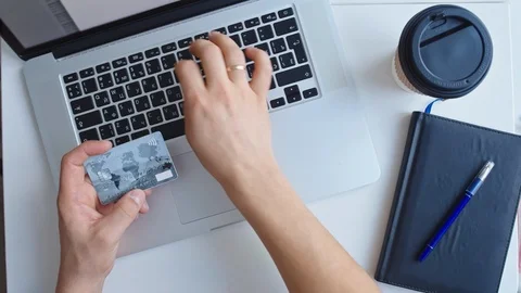 Man working on laptop placed on white desk Stock Footage 85631842