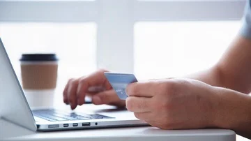 Man working on laptop placed on white desk Stock Footage 85632252