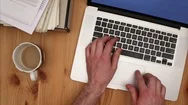 Man Working On Laptop With Pulsing Cup Of Coffee - Cinemagraph. Stock Footage