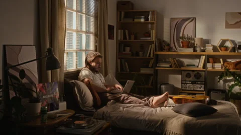Man Working on Laptop Remotely during Flexible Hours at Home Stock Footage 337510795