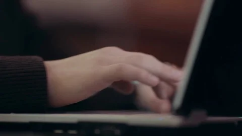 A man working at a laptop sitting in a cafe Stock Footage 71565424