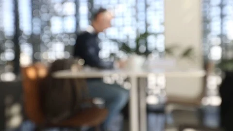 Man working on laptop at table blur Stock Footage 88351484