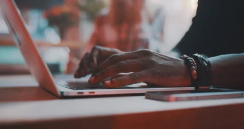 Man working on a laptop then picking up phone Stock Footage 203581986