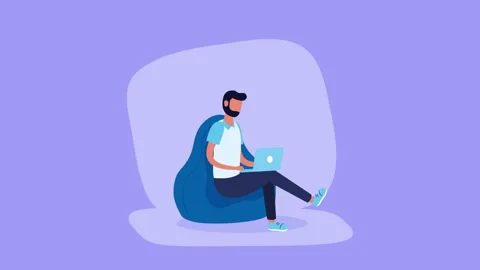Man working on laptop while sitting on comfortable beanbag chair in animate.. Stock Footage 333721552