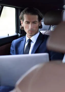 Man working on laptop while sitting in the car Stock Photos