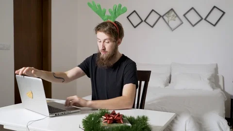 Man working late in a authentic room with Chrismas decoration. Stock Footage 102661278