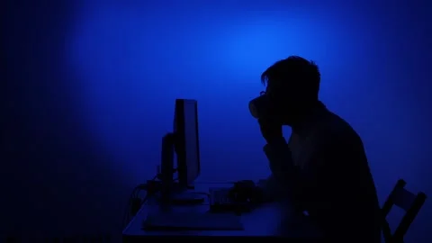 Man working late night on computer drinking coffee Stock Footage 318981484