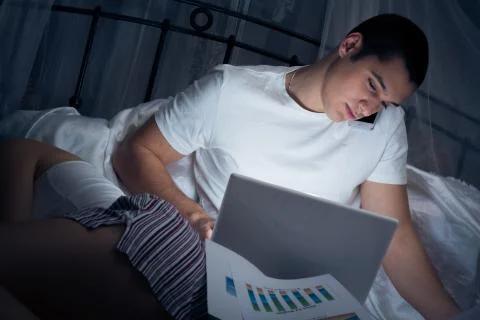 Man Working Late Stock Photos