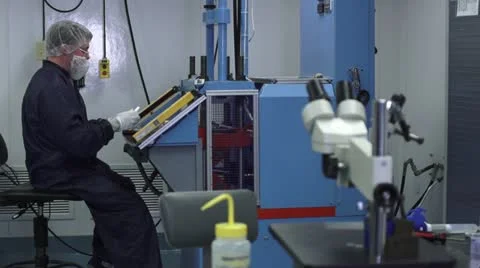 Man Working with Machine in Cleanroom Stock Footage 10895935
