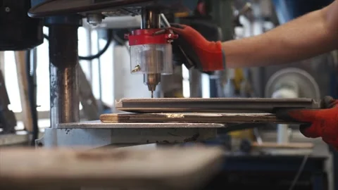 A man is working on a machine with a drill bit Video stock 302458188
