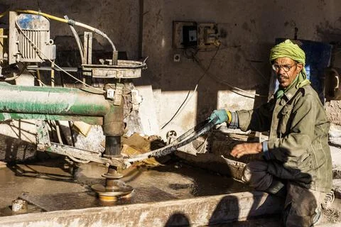 A man working with marble Stock Photos