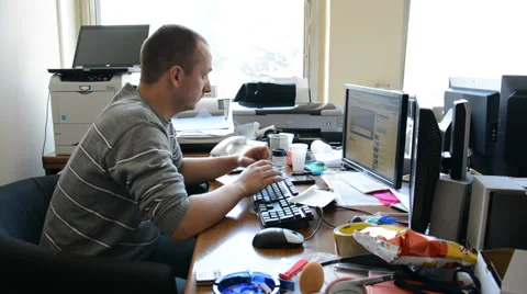 Man working in the messy office Stock Footage 39764453