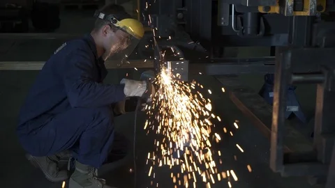 Man working with metal on a angle grinder Stock Footage 99914638